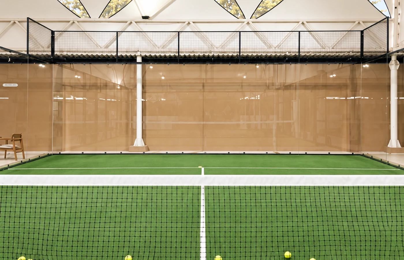 OLA court reset with balls and padel rackets.